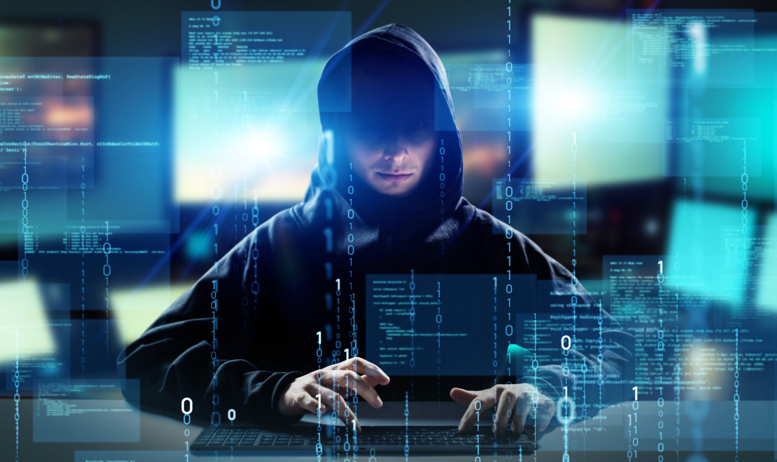 Hacker in PC room. Cyber crime. Wide image for banners, advertis