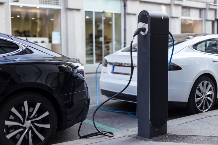 Electric vehicle being charged at a public charging point