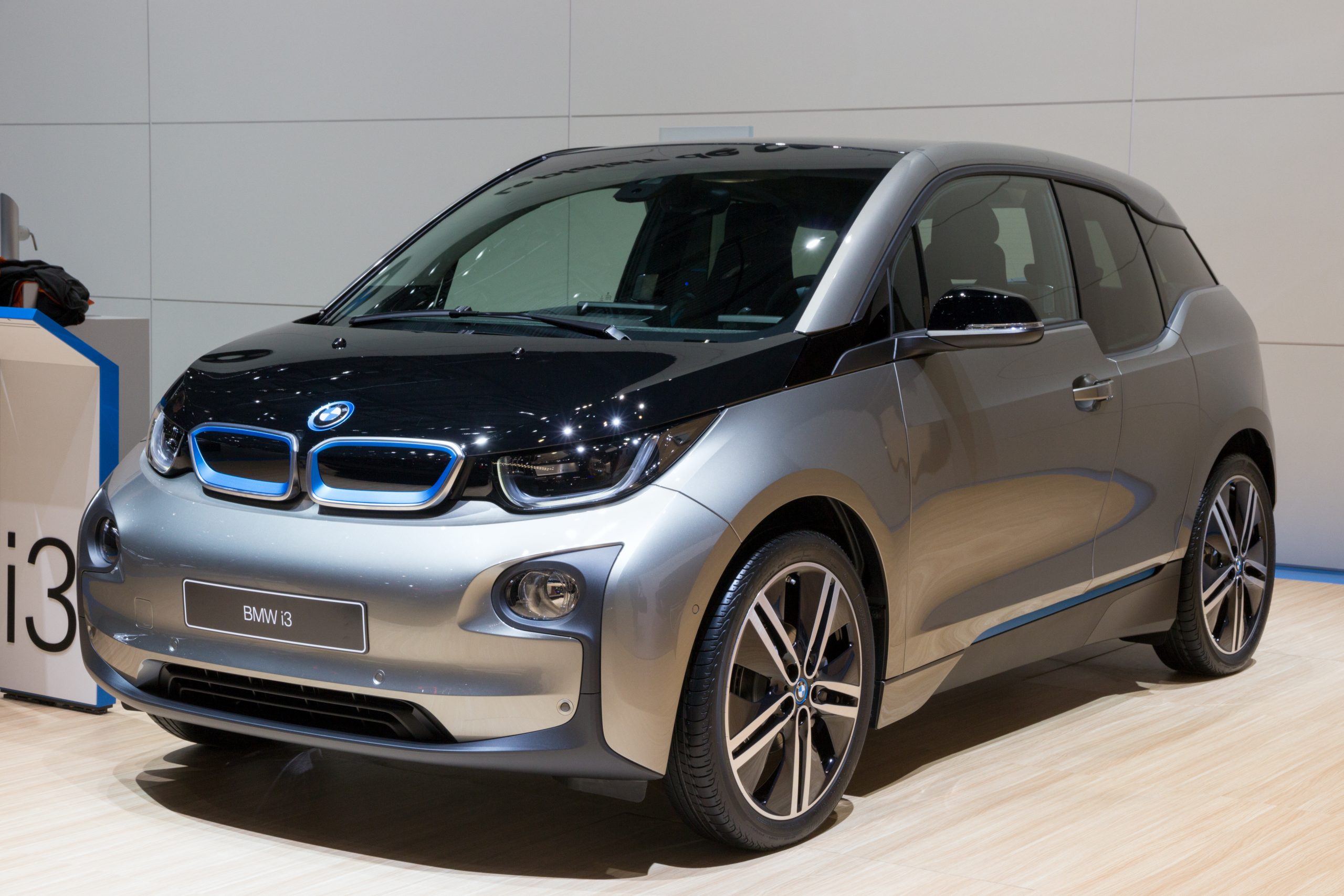 A silver BMW i3 electric car in a show room