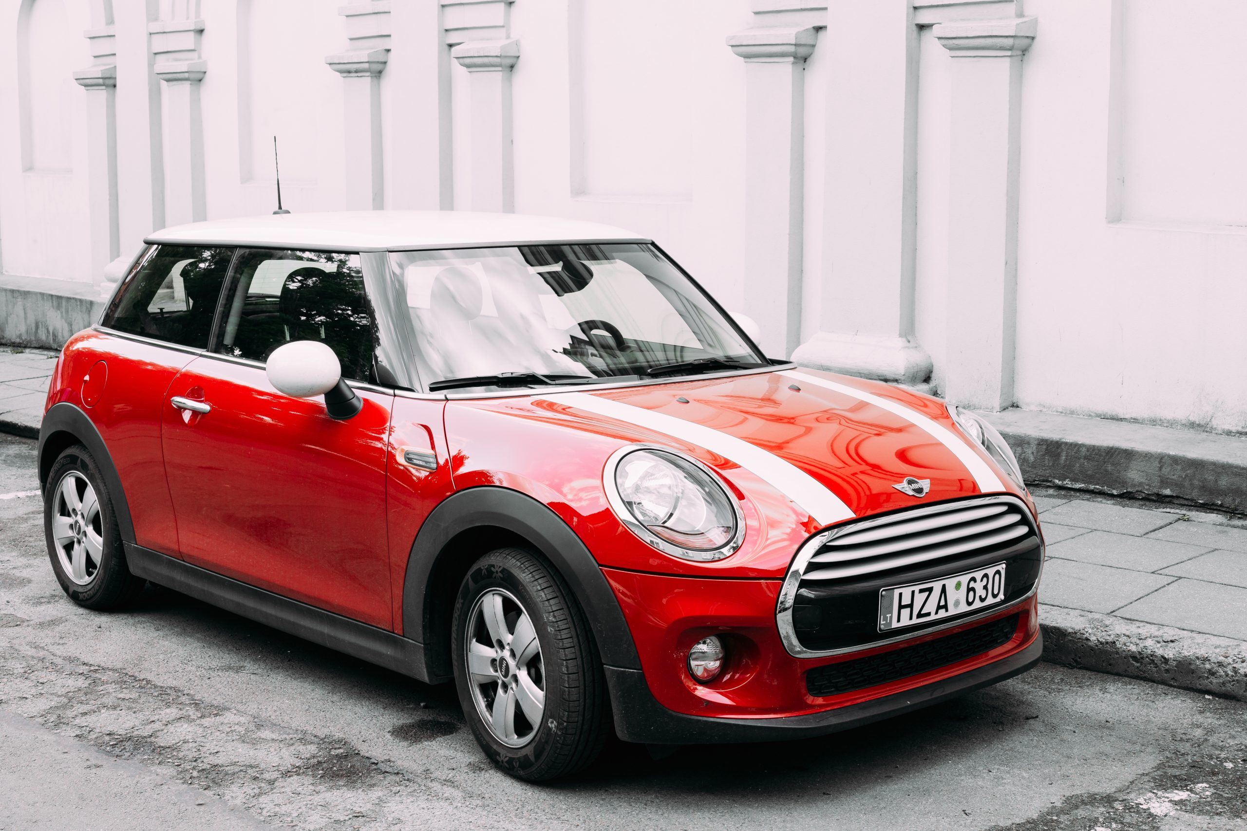 Red Color Car With White Stripes Mini Cooper Parked On Street 