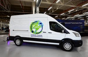 A White Ford E-Transit van on display in a show room