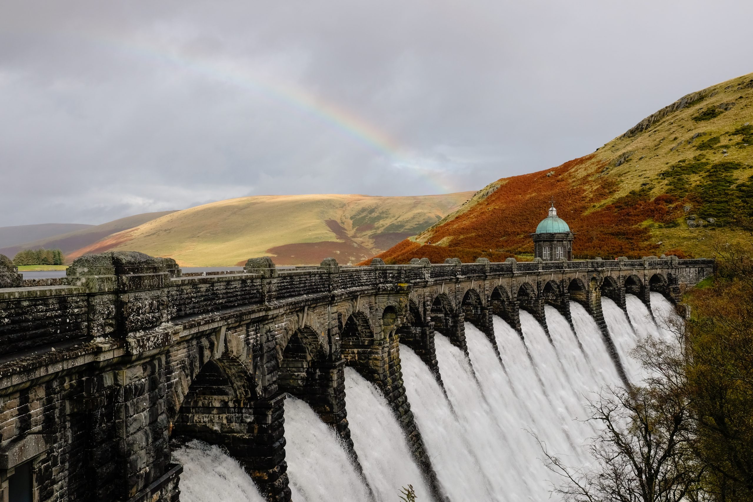 Autumn rainbow in the sky above Craig Goch Dam