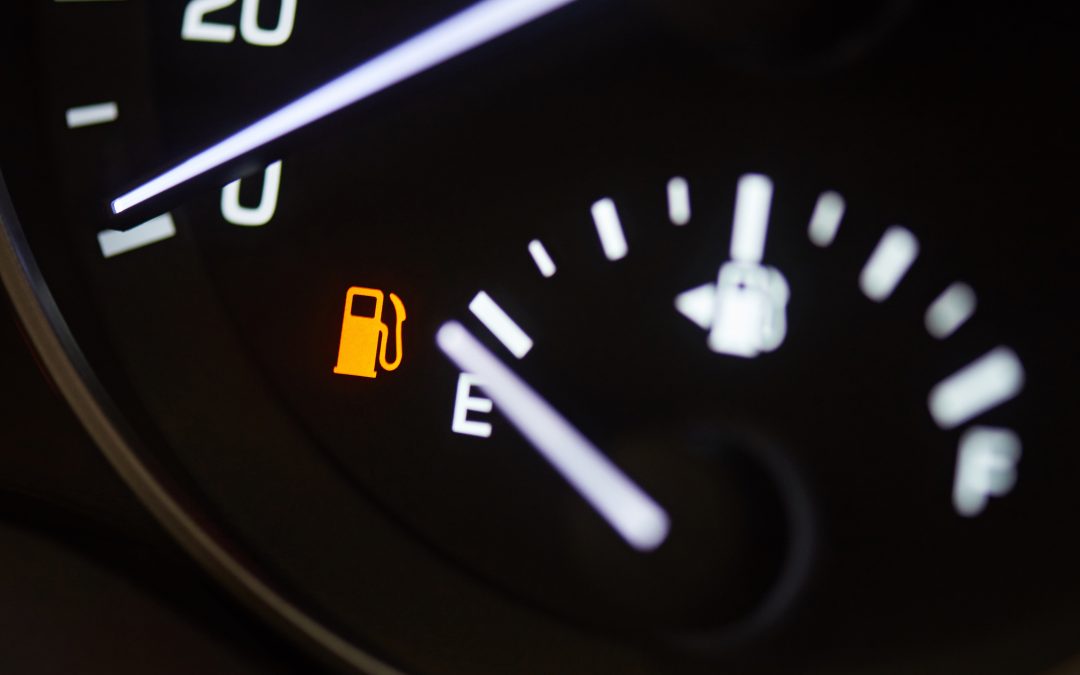 Fuel consumption theme. Empty tank indicator on car dashboard