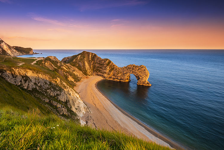 The sun goes down on the Jurassic coast and Durdle Door in Dorset