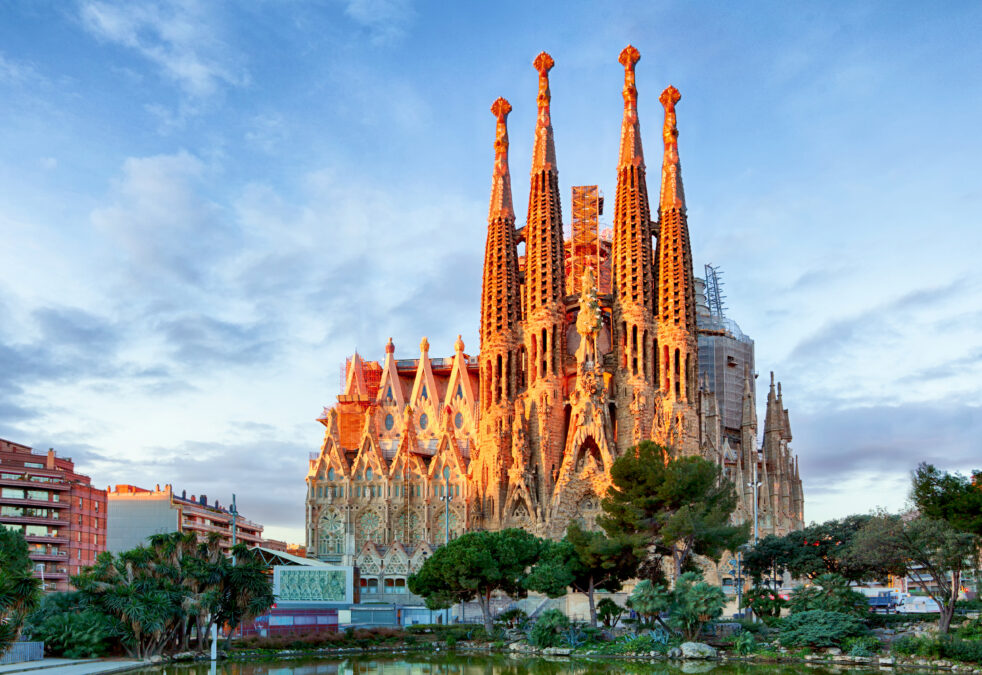 The Sagrada Familia Church Barcelona with greenery in front of it