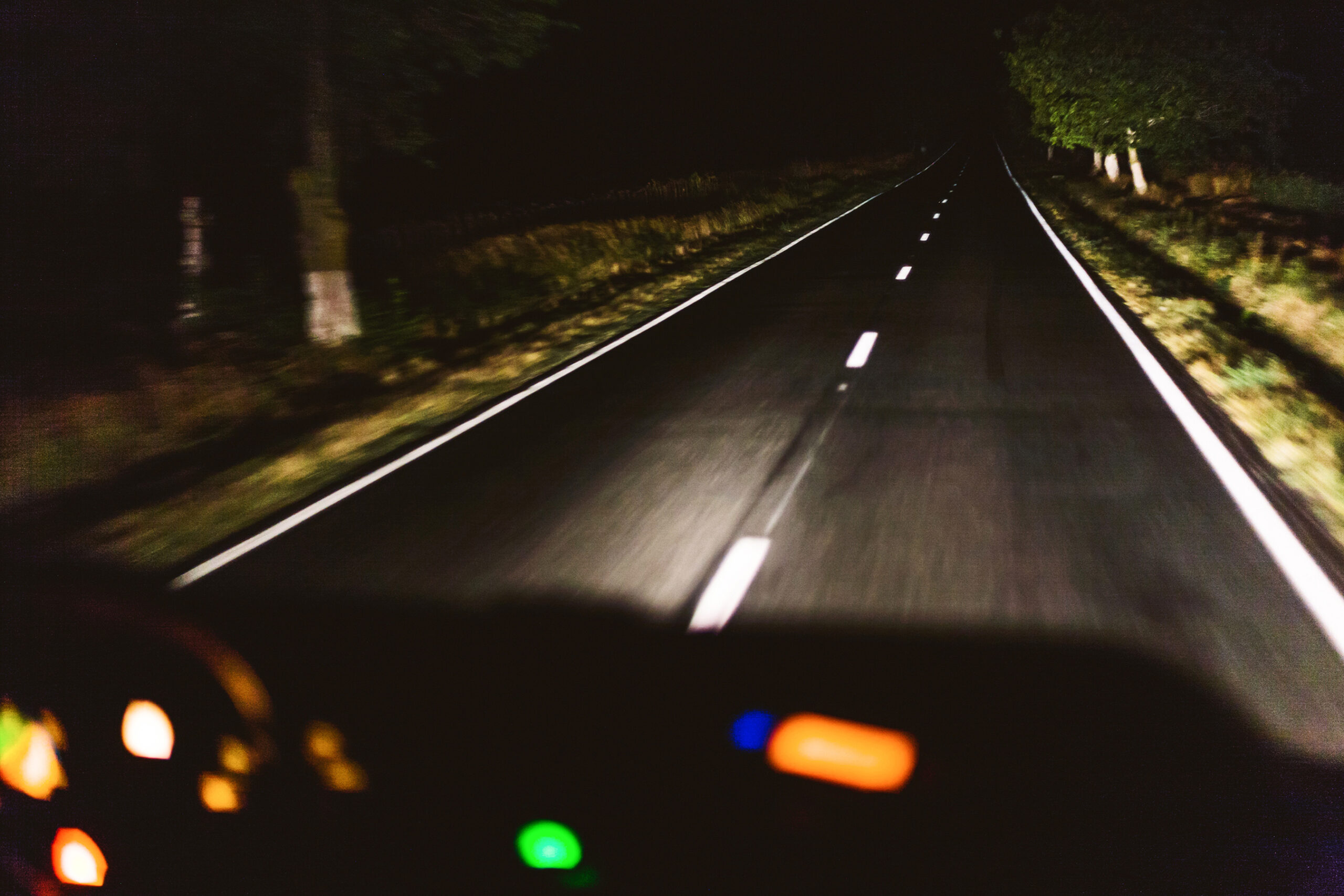 Fast night driving, view from inside of a car