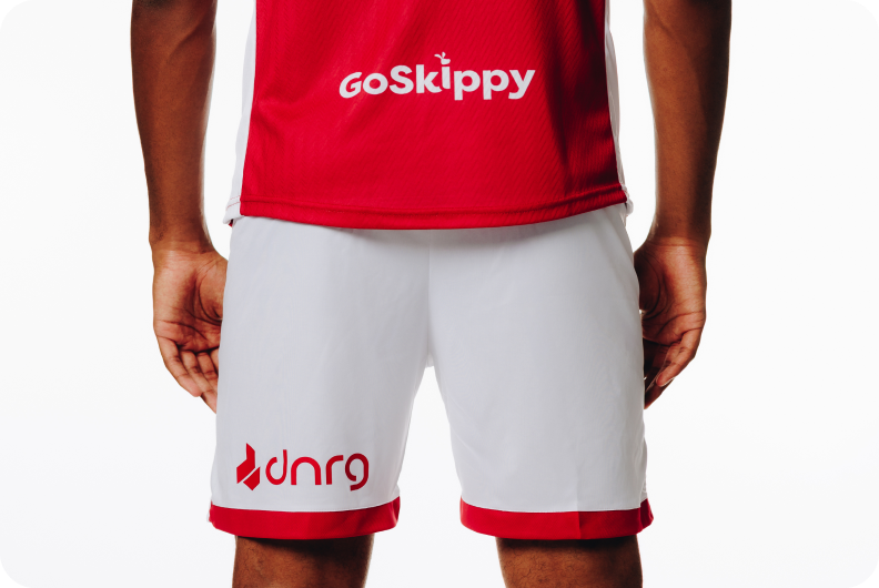 Red and white Bristol FC shirt sponsored by GoSkippy for the 2025-26 season
