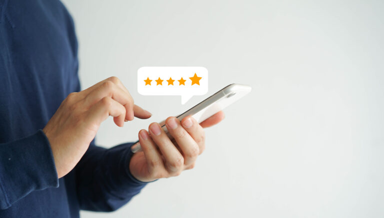 Person seeing 5 star rating on phone screen