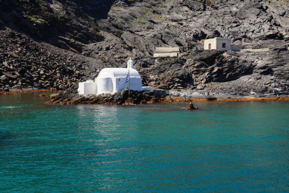 Small church at the hot springs on Palea Kameni Volcanic Island, Santorini Greece.