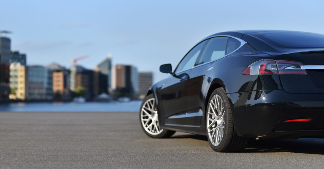 A rear view of a black car 